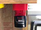 Milwaukee M12 battery holder mounted for storage